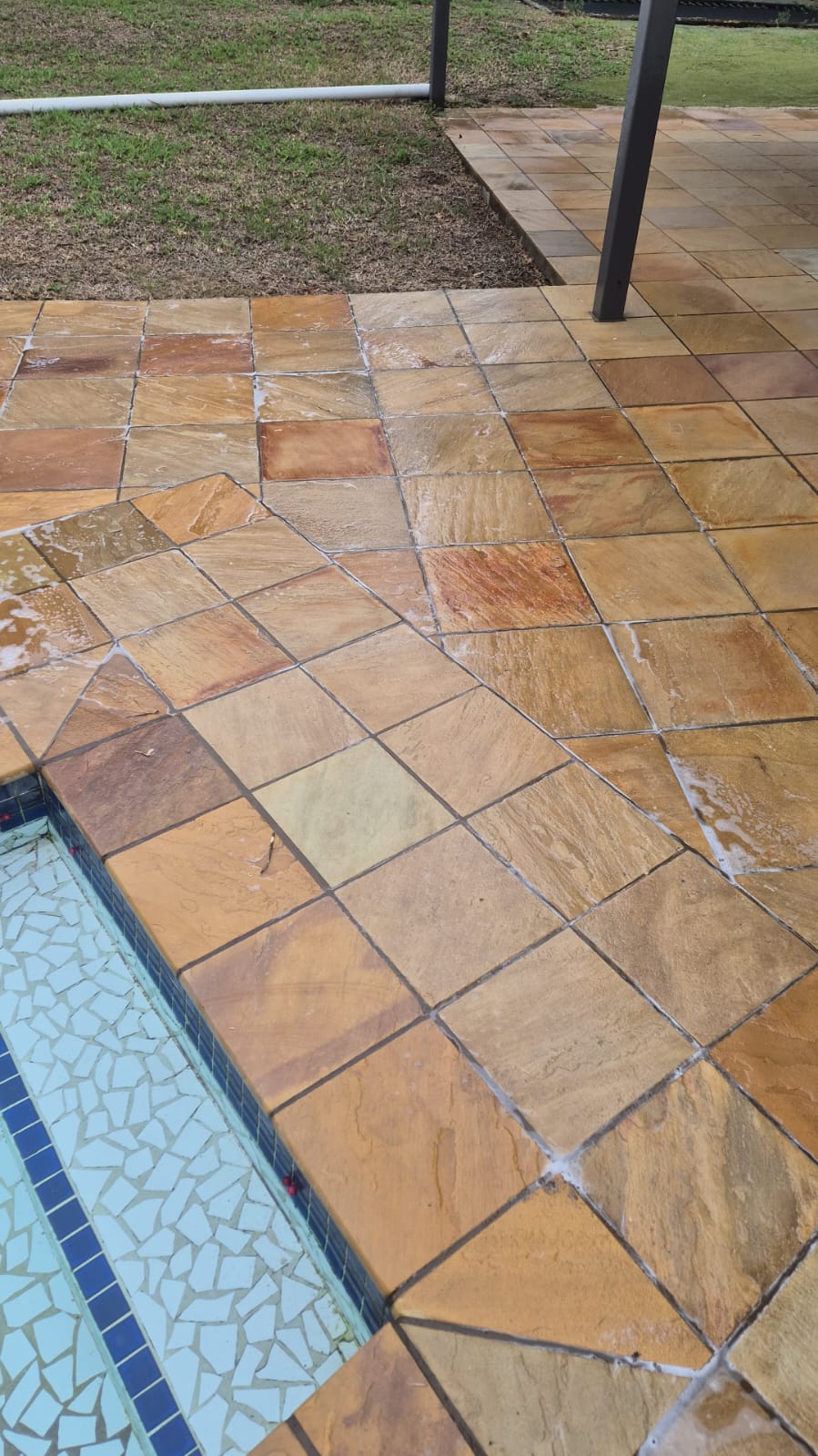 Paving tiles after cleaning — golden stone fully restored