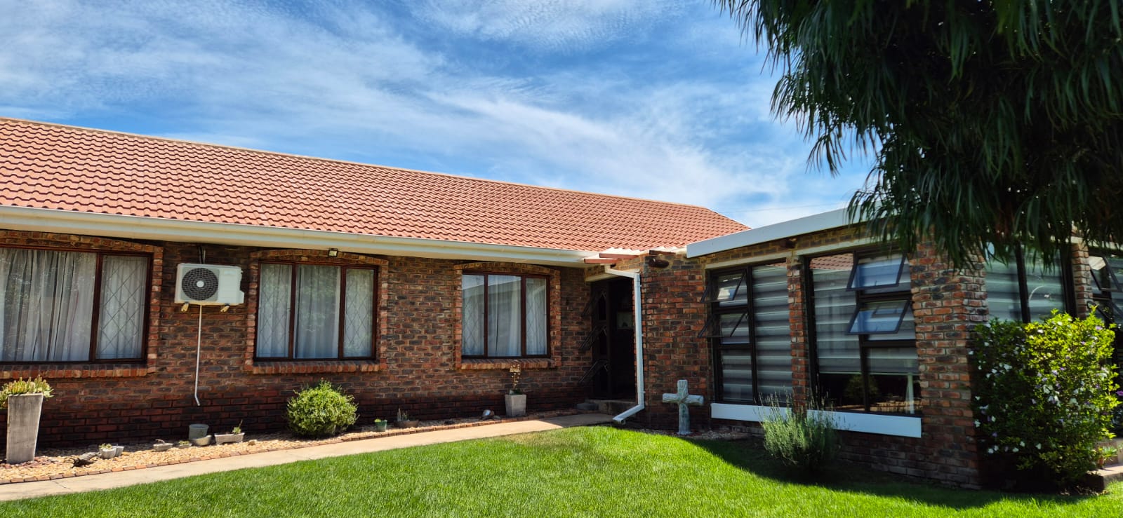 Roof after cleaning — bright terracotta tiles fully restored